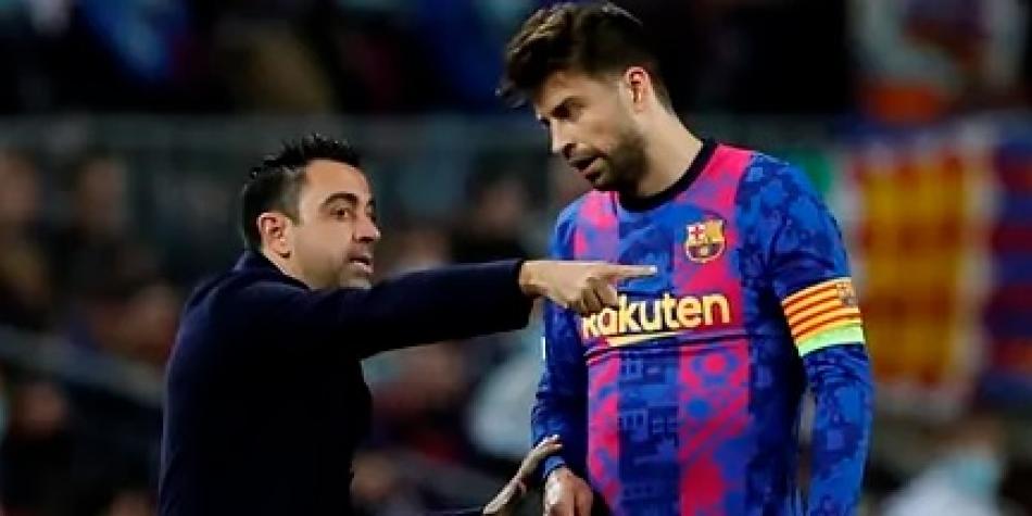 Xavi Hernández y Gerard Piqué