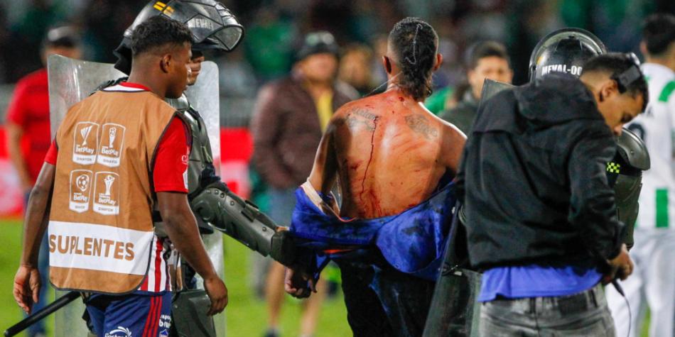 Desmanes Nacional vs Junior